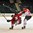 GRAND FORKS, NORTH DAKOTA - APRIL 21: Canada's Logan Stanley #20 knocks down Switzerland's Yannick Lerch #18 during quarterfinal round action at the 2016 IIHF Ice Hockey U18 World Championship. (Photo by Minas Panagiotakis/HHOF-IIHF Images)

